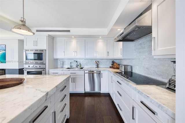 2901 S Bayshore Dr Unit 17G/H, Miami, FL 33133 - kitchen featuring stainless steel appliances, wall chimney range hood, white cabinetry, backsplash, and recessed lighting