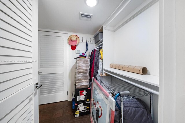 2901 S Bayshore Dr Unit 17G/H, Miami, FL 33133 - walk in closet featuring wood finished floors
