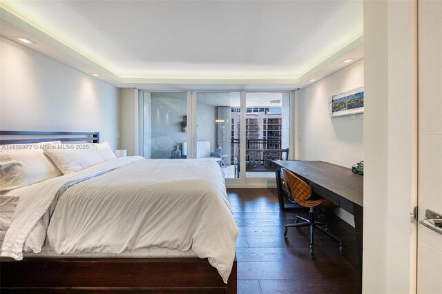 2901 S Bayshore Dr Unit 17G/H, Miami, FL 33133 - bedroom featuring dark wood finished floors and a tray ceiling