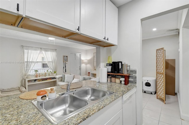 1470 N Dixie Hwy Unit 31, Fort Lauderdale, FL 33304 - kitchen with a sink, white cabinetry, light tile patterned floors, white dishwasher, and light stone counters