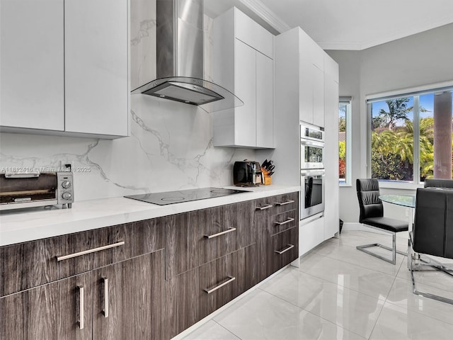 7448 SW 120th Ct, Miami, FL 33183 - kitchen featuring wall chimney range hood, black electric stovetop, decorative backsplash, crown molding, and white cabinetry