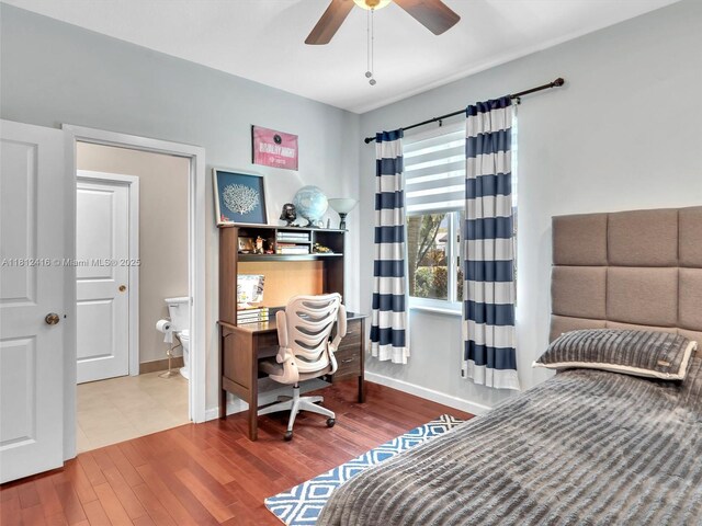 7448 SW 120th Ct, Miami, FL 33183 - bedroom with wood finished floors, an office area, baseboards, and a ceiling fan