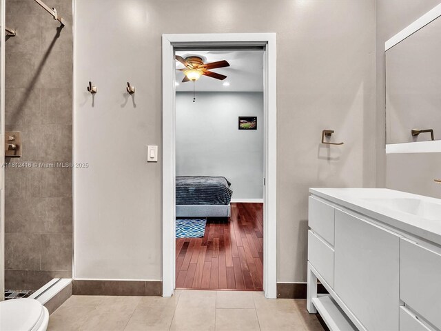 7448 SW 120th Ct, Miami, FL 33183 - ensuite bathroom featuring ceiling fan, vanity, baseboards, and tiled shower