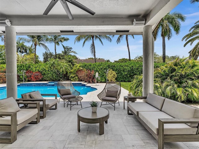 7448 SW 120th Ct, Miami, FL 33183 - view of swimming pool with outdoor lounge area, a ceiling fan, and a patio area