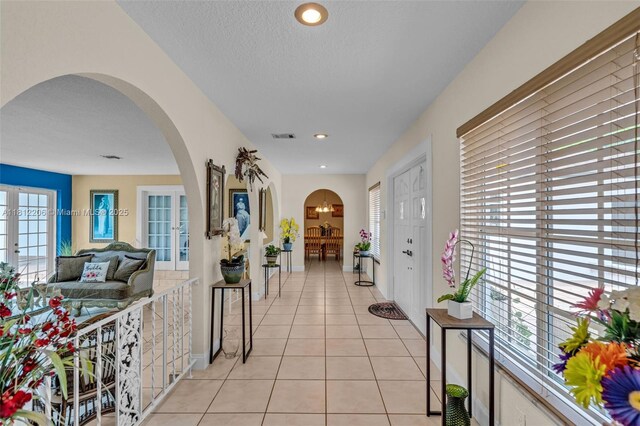 17550 SW 59th Ct, Southwest Ranches, FL 33331 - hallway featuring arched walkways, light tile patterned floors, and recessed lighting