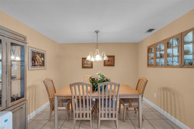 17550 SW 59th Ct, Southwest Ranches, FL 33331 - dining space with light tile patterned flooring and a chandelier