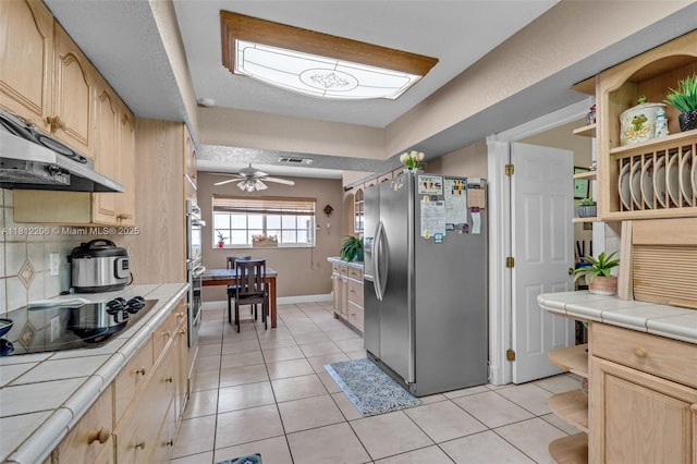 17550 SW 59th Ct, Southwest Ranches, FL 33331 - kitchen with appliances with stainless steel finishes, open shelves, tile counters, light brown cabinetry, and light tile patterned flooring