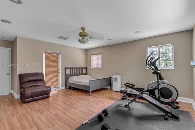 17550 SW 59th Ct, Southwest Ranches, FL 33331 - bedroom with light wood finished floors, ceiling fan, and a closet