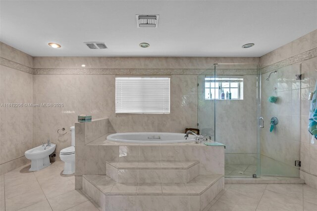 17550 SW 59th Ct, Southwest Ranches, FL 33331 - full bathroom with a garden tub, tile patterned floors, a shower stall, a bidet, and tile walls