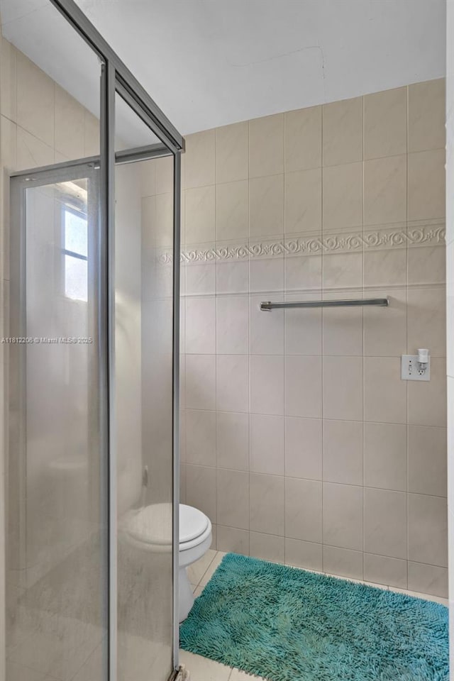 17550 SW 59th Ct, Southwest Ranches, FL 33331 - full bathroom with a stall shower, tile patterned flooring, and tile walls