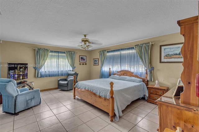 17550 SW 59th Ct, Southwest Ranches, FL 33331 - bedroom with light tile patterned floors, a textured ceiling, and ceiling fan