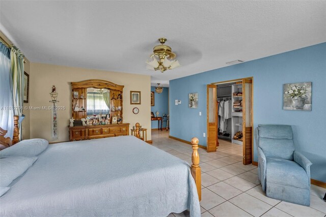 17550 SW 59th Ct, Southwest Ranches, FL 33331 - bedroom with light tile patterned flooring, a walk in closet, ceiling fan, and a closet