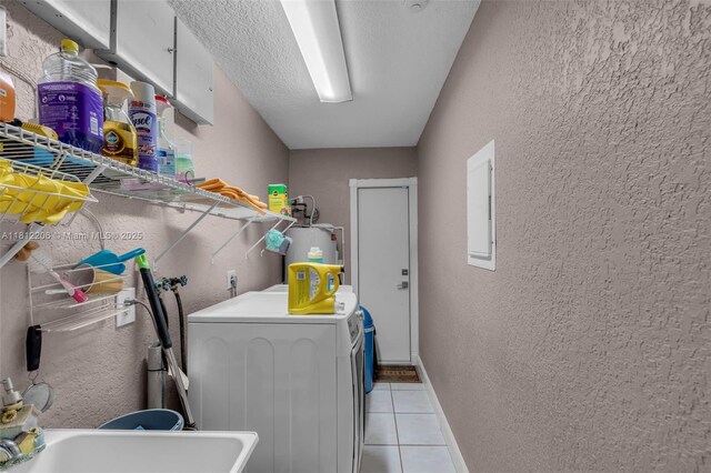 17550 SW 59th Ct, Southwest Ranches, FL 33331 - washroom featuring a textured wall, light tile patterned floors, electric water heater, washing machine and dryer, and electric panel