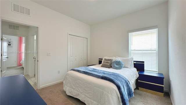 486 Disa Dr, Davenport, FL 33837 - bedroom with light carpet, a closet, and baseboards