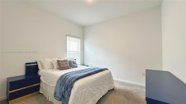 486 Disa Dr, Davenport, FL 33837 - bedroom with carpet and baseboards
