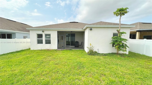486 Disa Dr, Davenport, FL 33837 - rear view of property featuring a sunroom and stucco siding