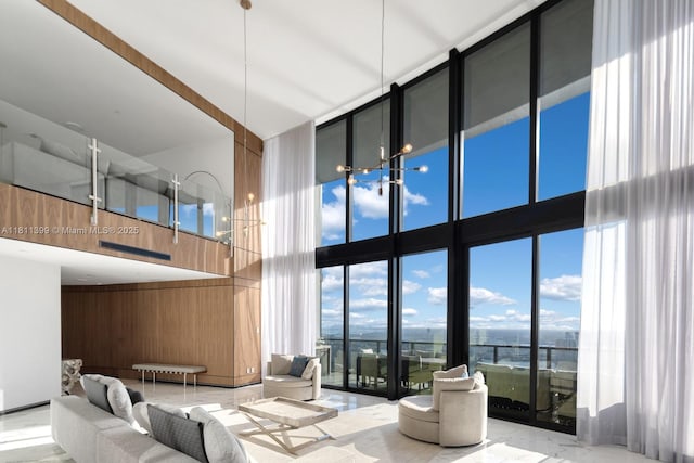 18555 Collins Ave Unit 4603, Sunny Isles Beach, FL 33160 - community lobby with a towering ceiling, a wall of windows, and wooden walls