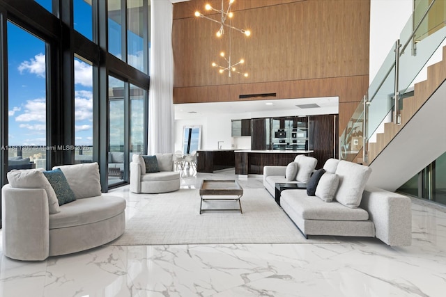 18555 Collins Ave Unit 4603, Sunny Isles Beach, FL 33160 - building lobby featuring a high ceiling and stairway