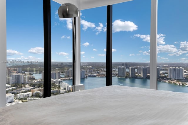 18555 Collins Ave Unit 4603, Sunny Isles Beach, FL 33160 - unfurnished bedroom with a view of city, a wall of windows, and a water view