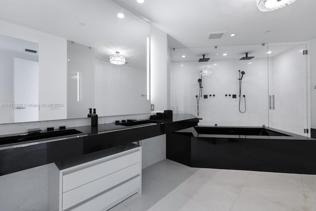 18555 Collins Ave Unit 4603, Sunny Isles Beach, FL 33160 - bathroom with a stall shower, recessed lighting, vanity, and a bath