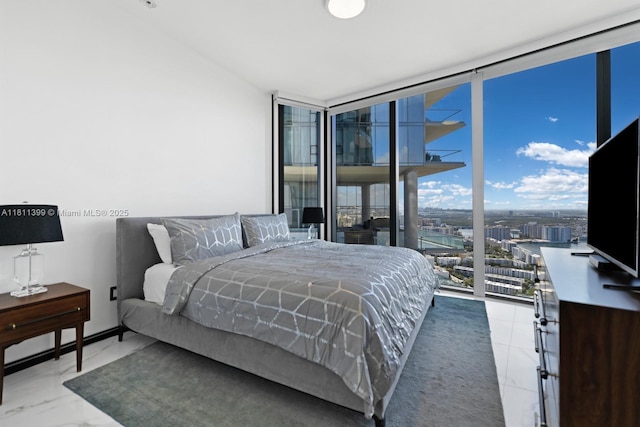 18555 Collins Ave Unit 4603, Sunny Isles Beach, FL 33160 - bedroom with a wall of windows and marble finish flooring