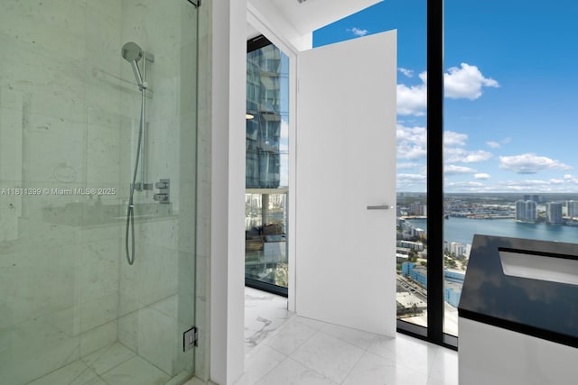 18555 Collins Ave Unit 4603, Sunny Isles Beach, FL 33160 - full bath with a stall shower, marble finish flooring, healthy amount of natural light, and a water view