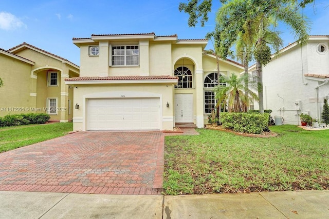 2434 SW 157th Ave, Miramar, FL 33027 - mediterranean / spanish house featuring stucco siding, a tiled roof, decorative driveway, a front lawn, and an attached garage