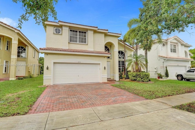 2434 SW 157th Ave, Miramar, FL 33027 - mediterranean / spanish-style house featuring a garage, decorative driveway, stucco siding, a tiled roof, and a front lawn