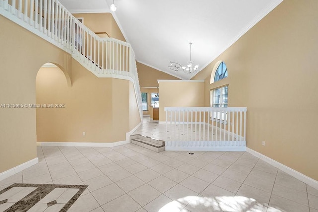 2434 SW 157th Ave, Miramar, FL 33027 - unfurnished living room featuring high vaulted ceiling, baseboards, tile patterned floors, a chandelier, and crown molding
