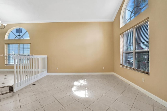 2434 SW 157th Ave, Miramar, FL 33027 - spare room featuring crown molding, light tile patterned floors, baseboards, and a chandelier