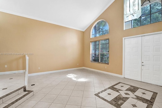 2434 SW 157th Ave, Miramar, FL 33027 - foyer with light tile patterned floors, ornamental molding, high vaulted ceiling, and baseboards