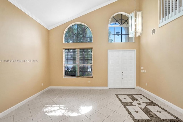 2434 SW 157th Ave, Miramar, FL 33027 - entryway with ornamental molding, light tile patterned floors, baseboards, and high vaulted ceiling