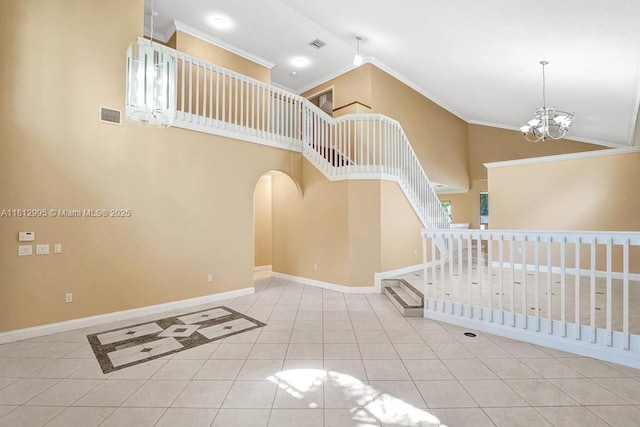 2434 SW 157th Ave, Miramar, FL 33027 - stairway with ornamental molding, tile patterned flooring, baseboards, high vaulted ceiling, and a chandelier