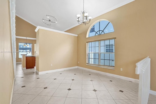 2434 SW 157th Ave, Miramar, FL 33027 - tiled empty room with a chandelier, ornamental molding, baseboards, and high vaulted ceiling