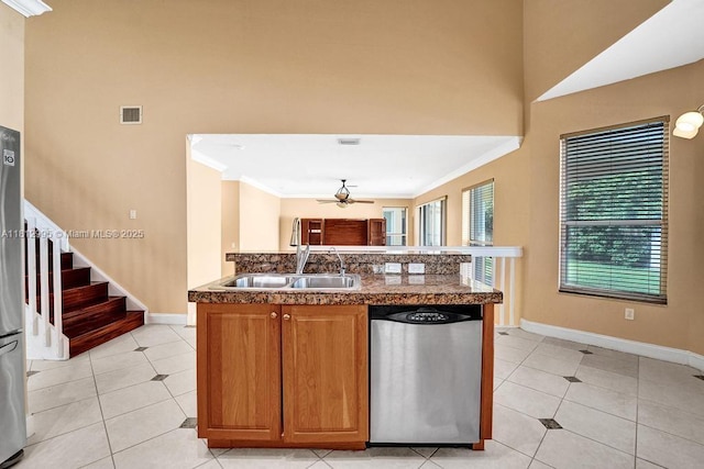 2434 SW 157th Ave, Miramar, FL 33027 - kitchen with stainless steel appliances, a sink, a ceiling fan, light tile patterned floors, and crown molding