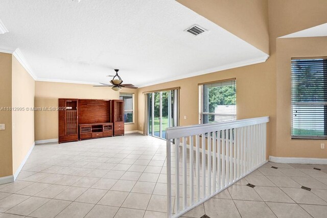 2434 SW 157th Ave, Miramar, FL 33027 - unfurnished living room featuring ornamental molding, tile patterned flooring, ceiling fan, and baseboards