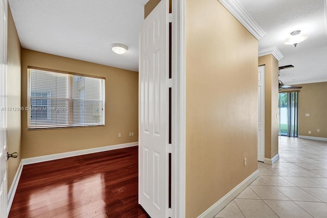 2434 SW 157th Ave, Miramar, FL 33027 - hall featuring crown molding, baseboards, and light tile patterned floors