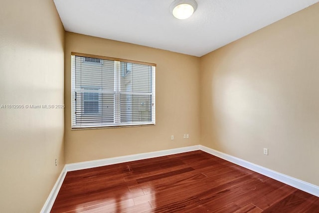 2434 SW 157th Ave, Miramar, FL 33027 - empty room with dark wood-style floors and baseboards