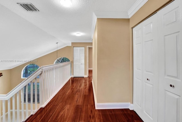 2434 SW 157th Ave, Miramar, FL 33027 - hallway featuring crown molding, baseboards, wood finished floors, and an upstairs landing