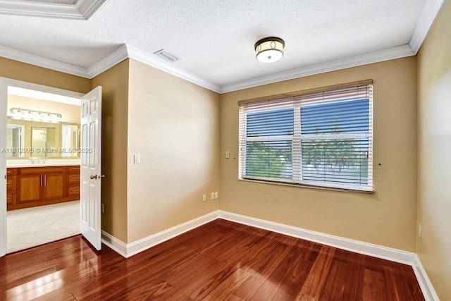 2434 SW 157th Ave, Miramar, FL 33027 - unfurnished room featuring wood finished floors, baseboards, crown molding, a sink, and a textured ceiling