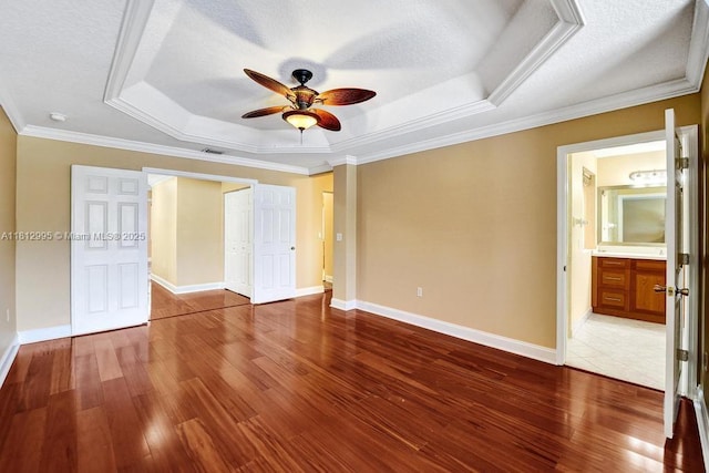 2434 SW 157th Ave, Miramar, FL 33027 - unfurnished bedroom with a raised ceiling, wood finished floors, crown molding, baseboards, and ceiling fan