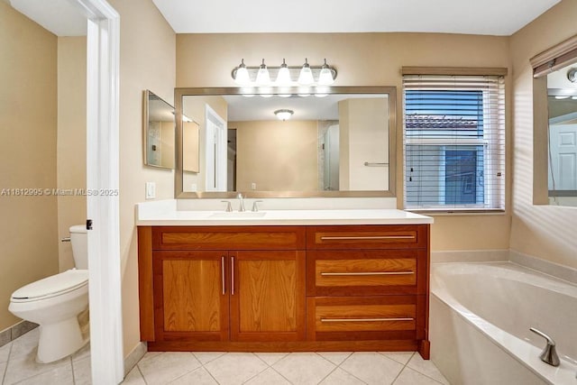 2434 SW 157th Ave, Miramar, FL 33027 - bathroom with vanity, tile patterned flooring, a garden tub, and toilet