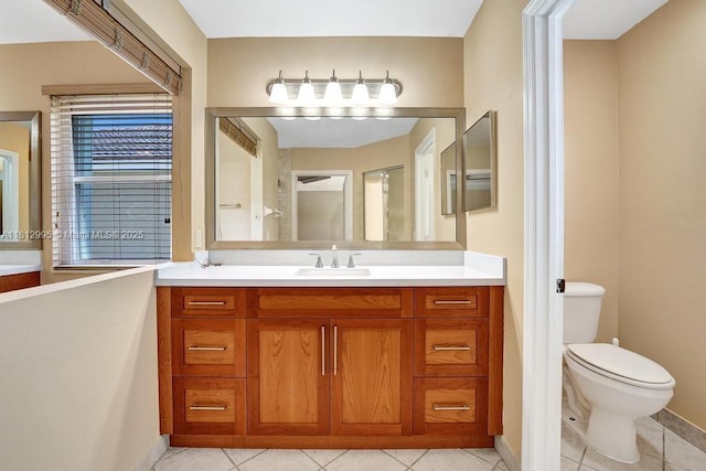2434 SW 157th Ave, Miramar, FL 33027 - bathroom featuring vanity, toilet, baseboards, and tile patterned floors