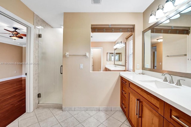 2434 SW 157th Ave, Miramar, FL 33027 - full bathroom featuring a ceiling fan, vanity, a shower stall, and tile patterned flooring