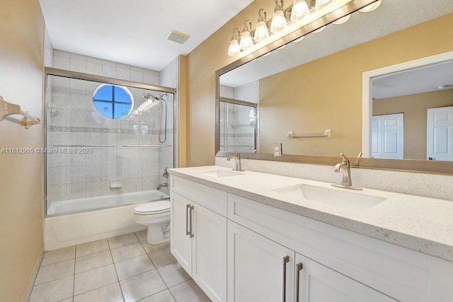 2434 SW 157th Ave, Miramar, FL 33027 - full bathroom with toilet, tile patterned flooring, double vanity, and shower / bath combination with glass door