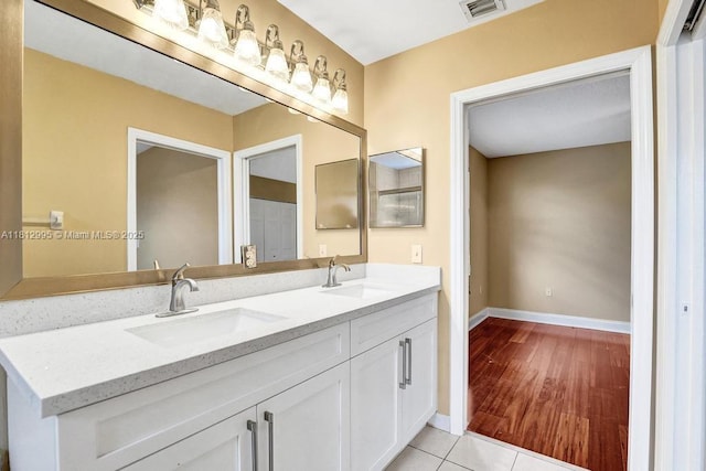 2434 SW 157th Ave, Miramar, FL 33027 - bathroom with double vanity, baseboards, and tile patterned floors