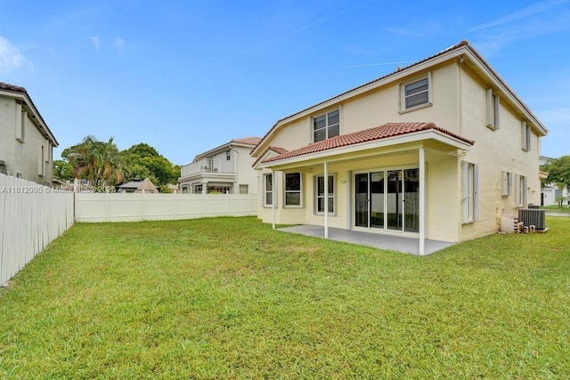 2434 SW 157th Ave, Miramar, FL 33027 - rear view of property featuring stucco siding, central AC unit, a tile roof, and a patio