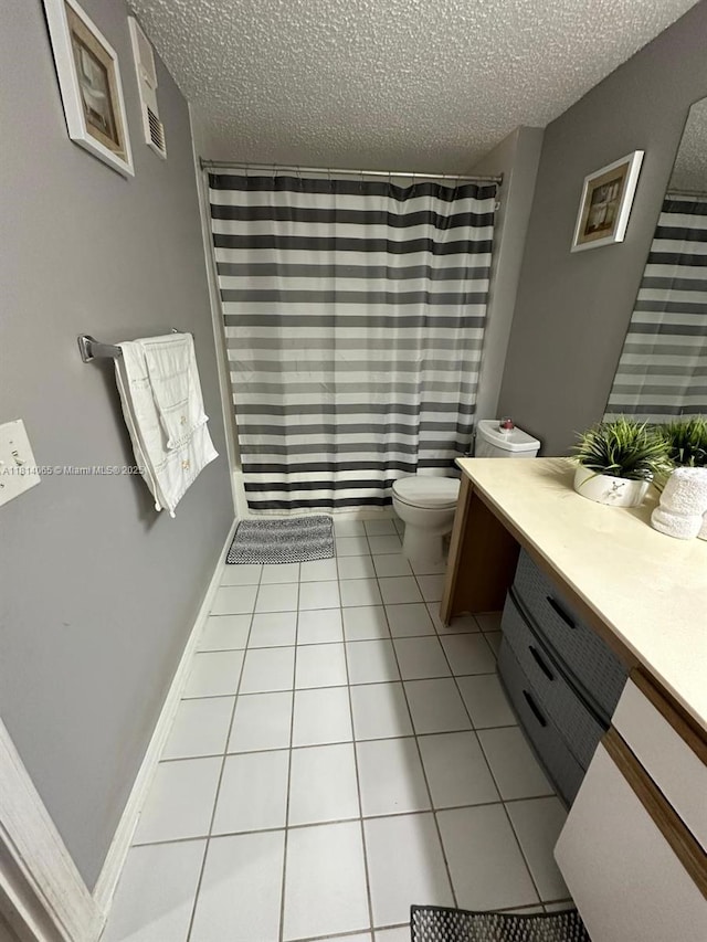 3995 W Mcnab Rd Unit B212, Pompano Beach, FL 33069 - full bathroom with vanity, toilet, a textured ceiling, tile patterned flooring, and curtained shower