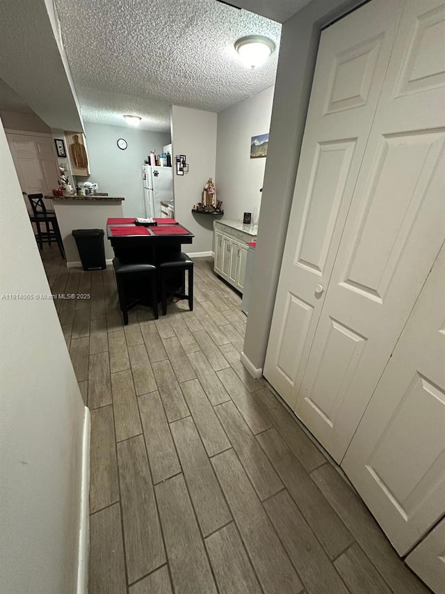 3995 W Mcnab Rd Unit B212, Pompano Beach, FL 33069 - recreation room with wood tiled floors, a textured ceiling, baseboards, and pool table