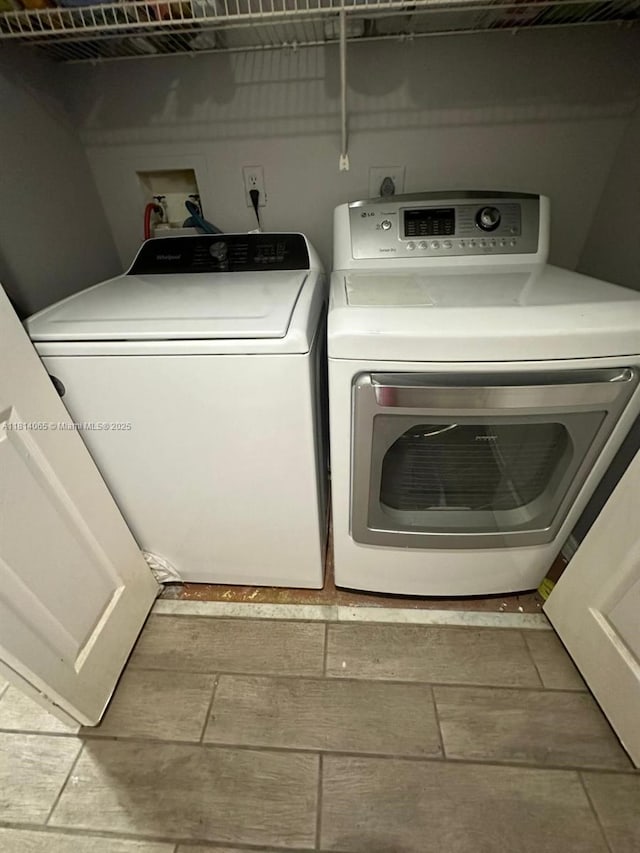 3995 W Mcnab Rd Unit B212, Pompano Beach, FL 33069 - laundry room featuring washer and dryer